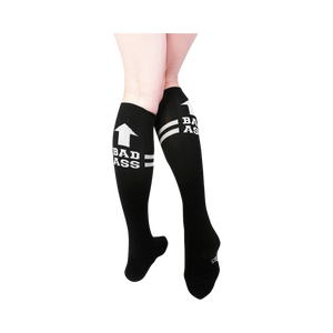 black and white knee-high socks featuring bold text 