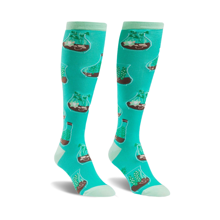mint green knee-high socks for women featuring a pattern of terrariums with brown soil, green plants, and white rocks. botanical theme.   }}
