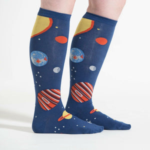 Lifestyle shot showing the Planets socks on a person's legs against a white background.