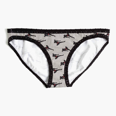 Grey hipster socks with a black lace trim. The socks feature a repeating pattern of black silhouettes of women in ninja poses with accents of red.