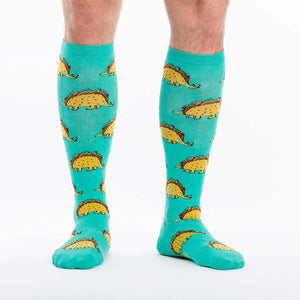 Flat lay of the Tacosaurus knee-high socks on a white background.