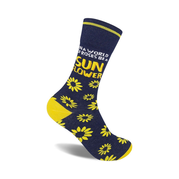 Crew socks in navy blue with yellow sunflowers and the text 'In a world of roses, be a sunflower.' }}