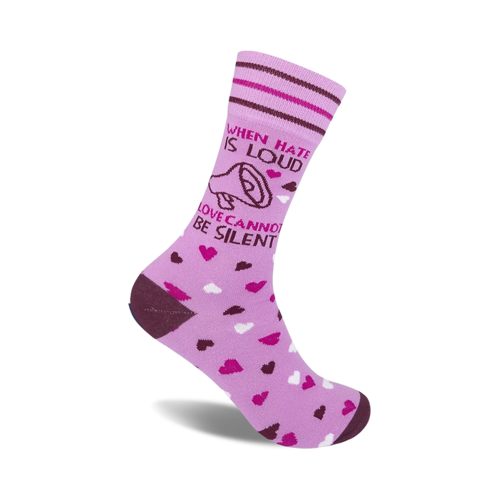 Lavender crew socks with a brown megaphone graphic and the text 'When hate is loud, love cannot be silent'.  Scattered pink and white hearts adorn the sock. }}