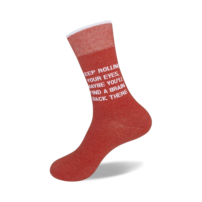 A pair of red socks with white lettering that reads ?Ç£Keep rolling your eyes, maybe you?ÇÖll find a brain back there?Ç¥.
