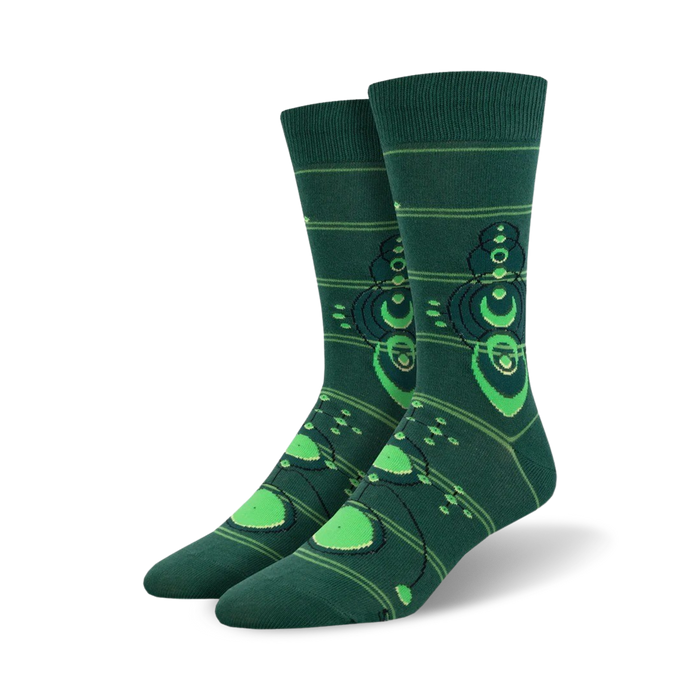 dark green men's crew socks with a pattern of crop circles in a lighter shade of green.   }}