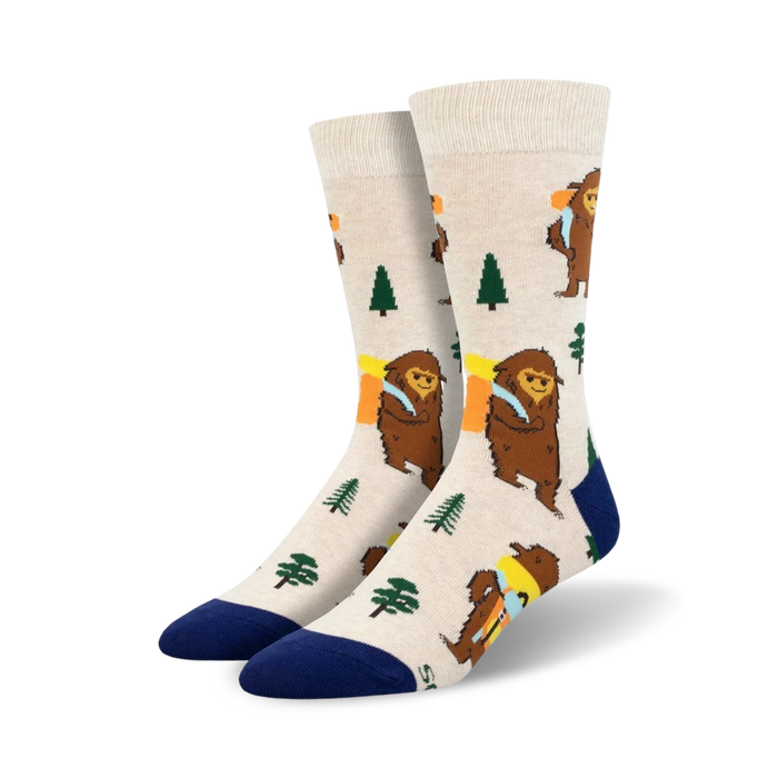 white crew socks featuring cartoon bigfoot hiking through green woods with brown trees. perfect for adventurers and bigfoot enthusiasts. men's size. }}