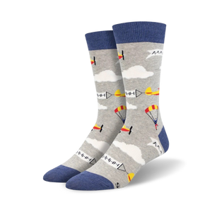 Pair of crew socks; light grey and blue; airplanes, parachutes, and clouds pattern.