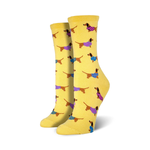 Lifestyle shot of the yellow Haute Dog socks on a model's feet.