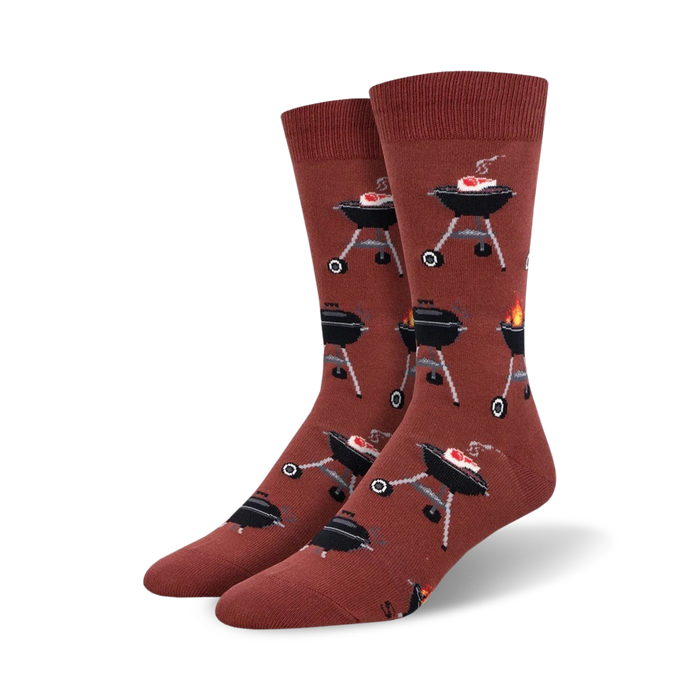 fired up socks: crew length bbq themed socks for men with cartoon grills, flames, and red steaks.    }}