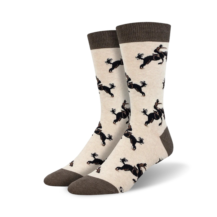 Pair of cream crew socks with a repeating pattern of black dogs riding horses. Brown cuff.