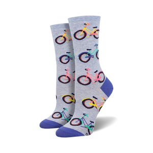 Pair of women's crew socks. Light blue and grey with colorful bicycle pattern.  Purple, pink, and teal accents.