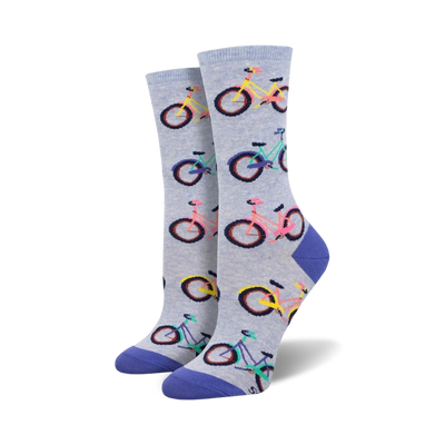Pair of women's crew socks. Light blue and grey with colorful bicycle pattern. Purple, pink, and teal accents.