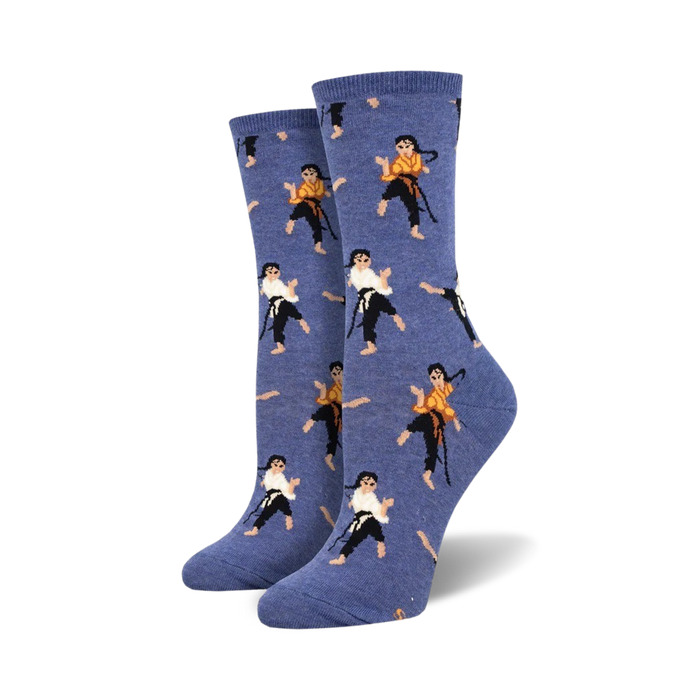 blue crew socks with pattern of women in martial arts poses wearing white uniforms and black belts.   }}