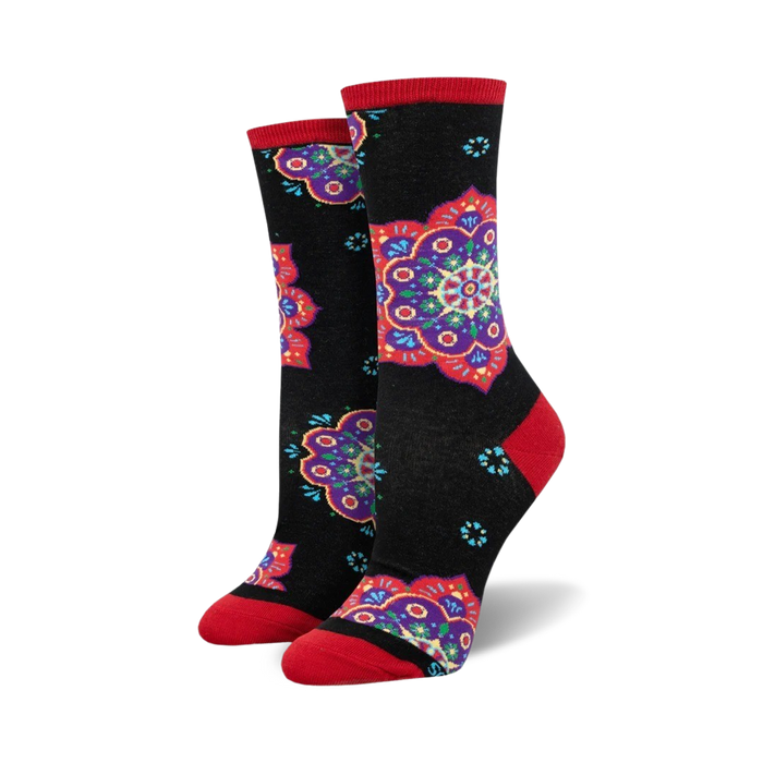 Pair of crew socks with black background and colorful mandala designs in red, purple, and teal. Red accents at the cuffs. }}