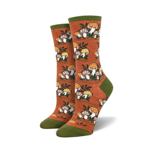Lifestyle photo showing the orange Magic Mountain socks on a person's feet, suggesting outdoor or nature-related activities.