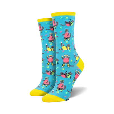 Pair of women's crew socks in teal, featuring a pattern of grey cats in bright pink and neon yellow Jazzercise outfits. Musical notes are scattered throughout.