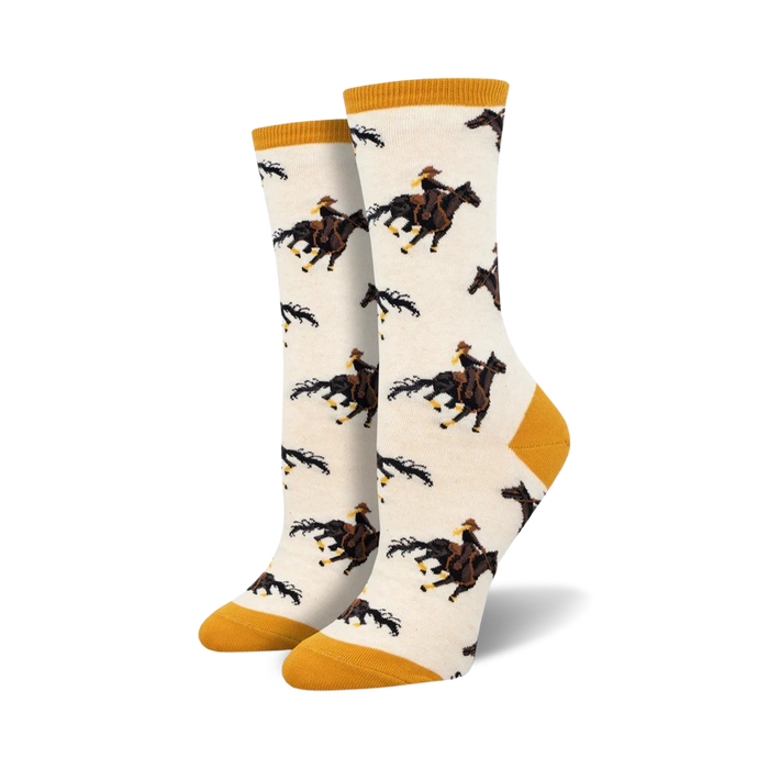 white crew socks with a yellow top, brown heel and toe featuring a cowboy on a galloping horse.    }}