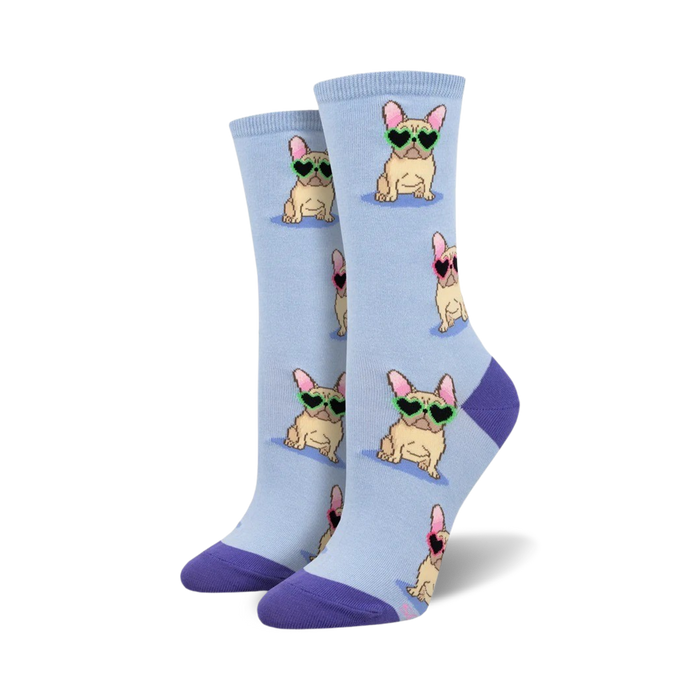 A pair of light blue crew socks with a repeating pattern of French Bulldogs wearing heart-shaped sunglasses. The socks have purple cuffs. }}