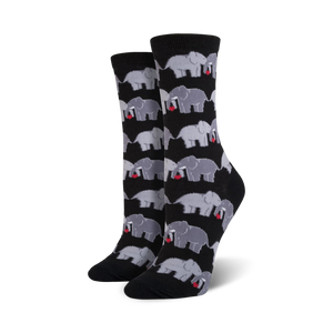 Close-up shot of a pair of black crew socks with a pattern of grey elephants holding hearts.