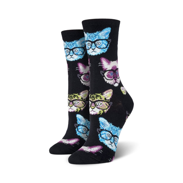 Lifestyle shot of a person relaxing with a book and a cup of coffee, wearing Kittenster socks.