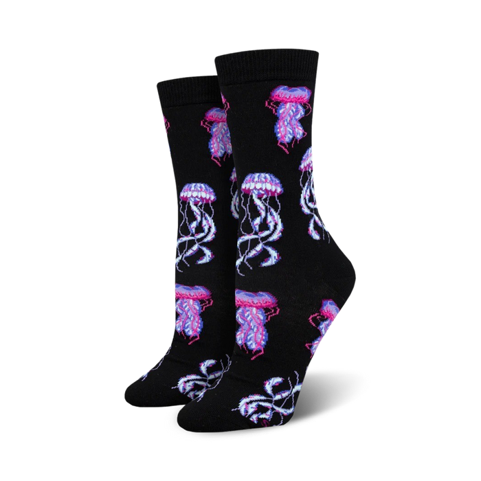 Pair of women's crew socks, black background with pink and purple jellyfish pattern. Made from bamboo material.