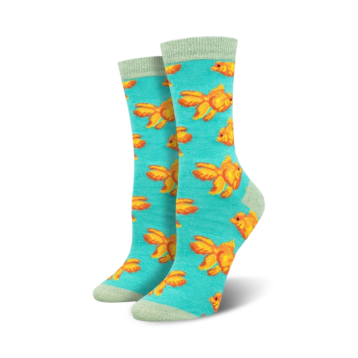 Pair of teal crew socks featuring a pattern of orange goldfish.  Soft bamboo material.  Fun and quirky design. }}