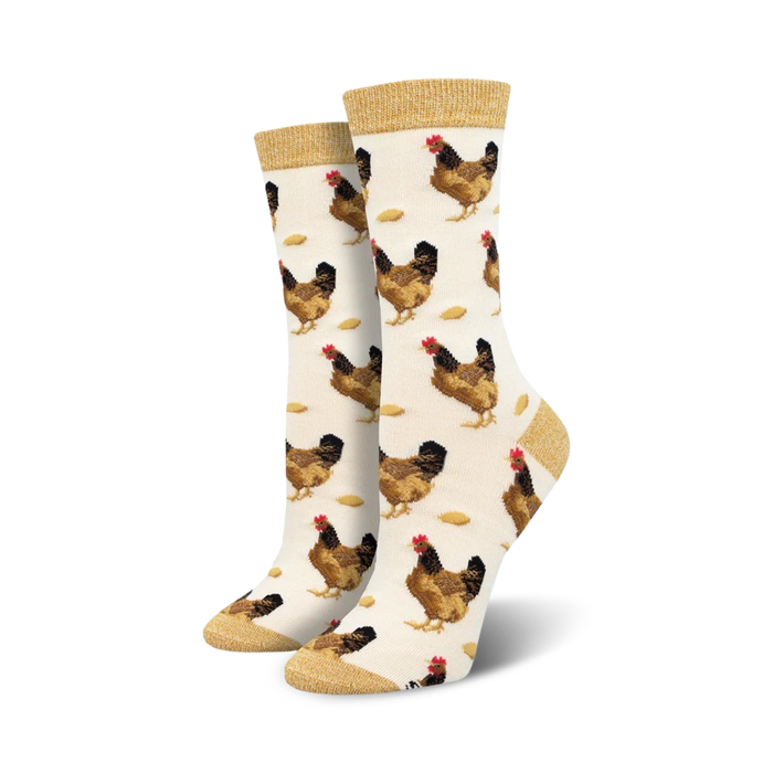 Pair of cream women's crew socks with brown chickens and light brown feed scattered across them. The socks have a gold-colored cuff. }}