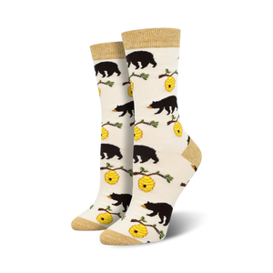 Cream crew socks with black bear and honeycomb design.  Features gold top cuff.