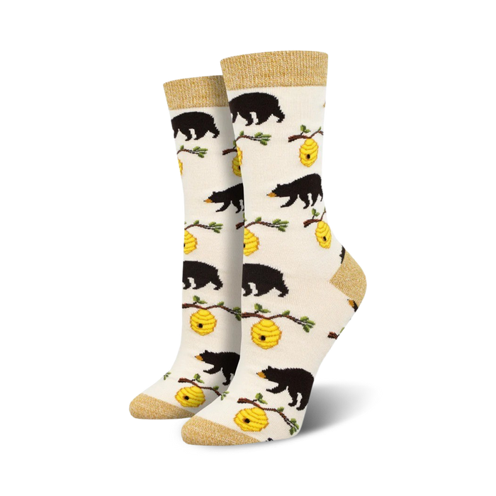 Cream crew socks with black bear and honeycomb design.  Features gold top cuff.