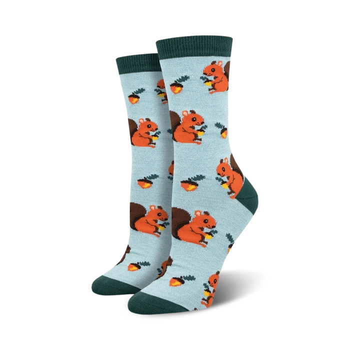 Pair of women's crew socks, light blue with orange squirrels and acorns. Dark green cuffs. }}