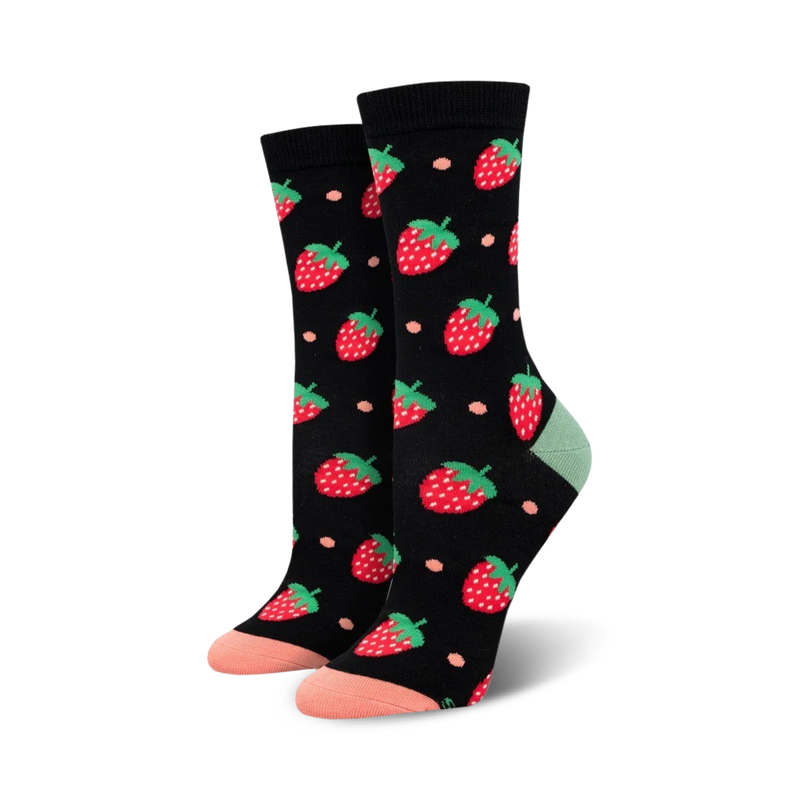 Pair of women's crew socks; black background with red strawberries and peach accents; soft bamboo fabric.