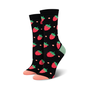 Pair of women's crew socks; black background with red strawberries and peach accents; soft bamboo fabric.