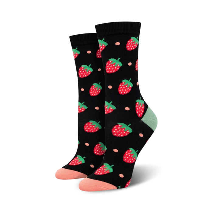 Pair of women's crew socks; black background with red strawberries and peach accents; soft bamboo fabric.