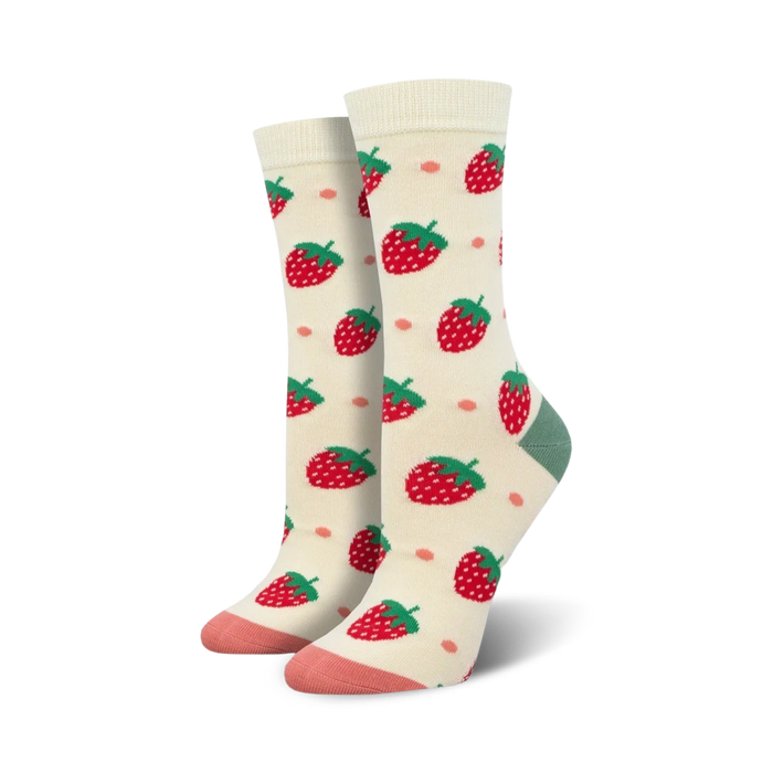 Close-up of Strawberry Delight Bamboo socks in cream color showing strawberry pattern and peach and teal details.