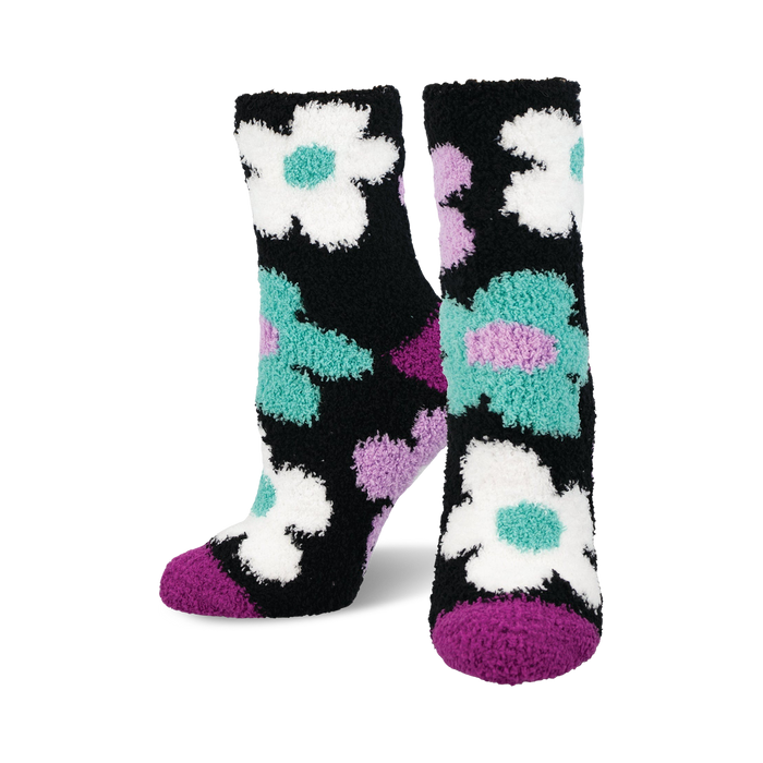 Fuzzy crew socks in black with teal, purple, and white daisies. Soft and cozy. }}