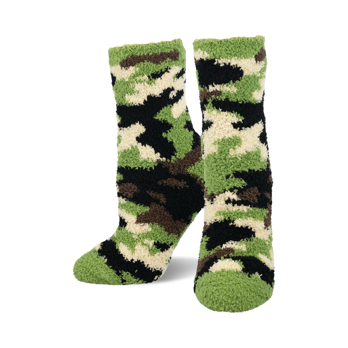 Pair of fuzzy crew socks in a camouflage pattern. The main colors are green, black, and cream. }}