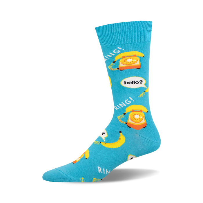 Bright blue crew sock with a repeating pattern of yellow rotary phones and yellow bananas, some with speech bubbles. }}