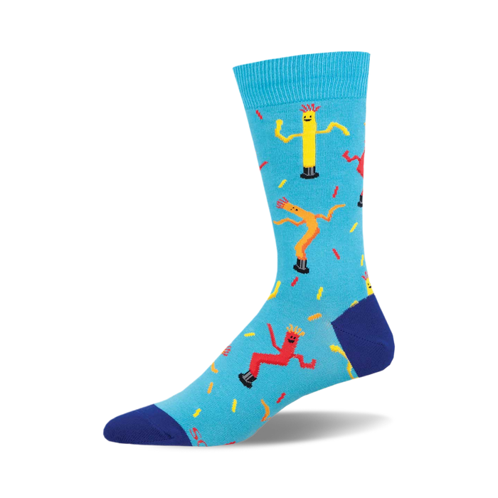 the blue socks have a pattern of yellow, red, and orange inflatable tube men on them. the tube men are arranged in a repeating pattern. }}