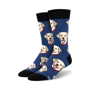 Close-up shot of a pair of blue crew socks with a pattern of yellow Labrador retrievers wearing red collars.