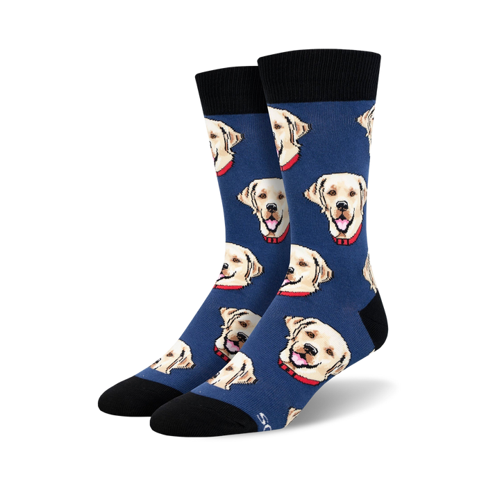 Close-up shot of a pair of blue crew socks with a pattern of yellow Labrador retrievers wearing red collars.