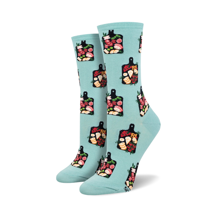 Lifestyle shot showing a person wearing the teal 'Charcuterie' socks.