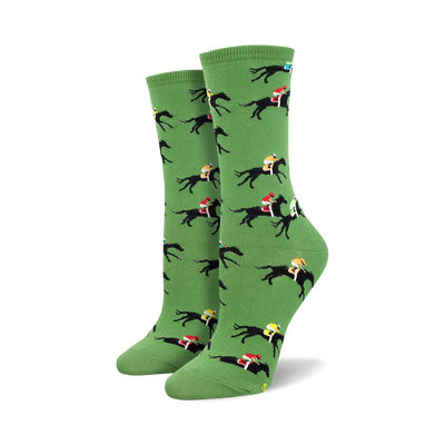 Pair of women's crew socks in green, featuring a repeating pattern of black horses and colorful jockeys.