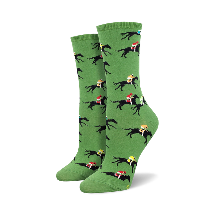 Pair of women's crew socks in green, featuring a repeating pattern of black horses and colorful jockeys. }}