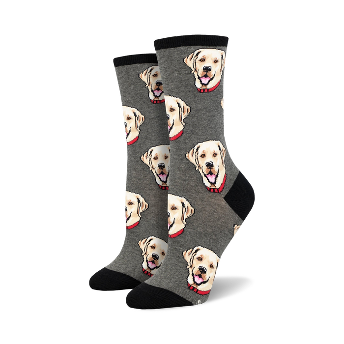 Pair of crew socks with a repeating pattern of yellow Labrador Retriever faces on a grey background.  Black cuffs.