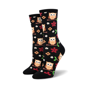 Pair of women's crew socks. Black background with adorable owls and flowers. Brown, orange, and red accents.