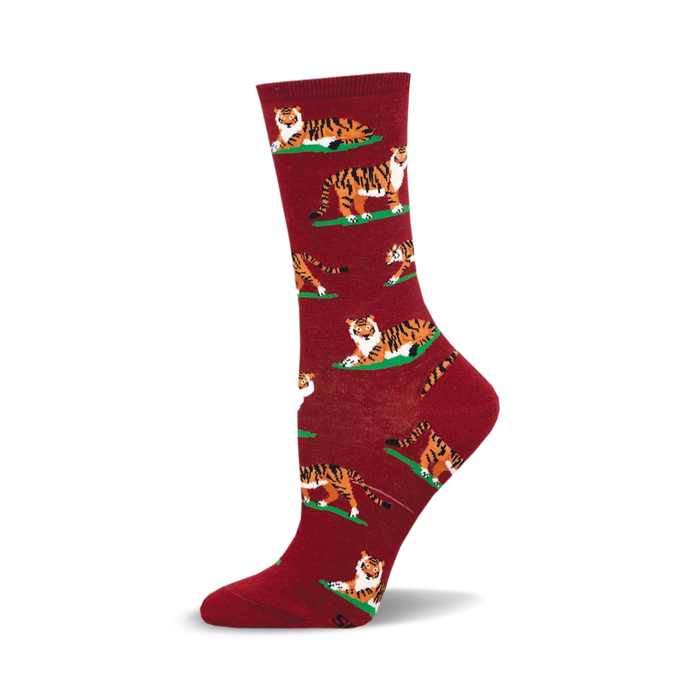 A maroon crew sock with a repeating pattern of orange tigers lying on small green patches. The tigers are stylized and playful. }}