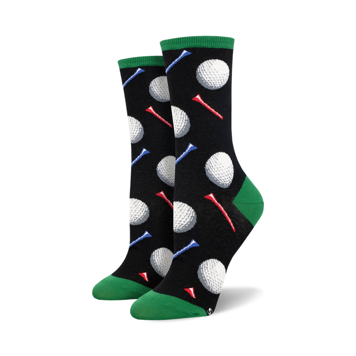 Pair of black crew socks with colorful golf tees and white golf balls printed on them. Green cuffs. }}