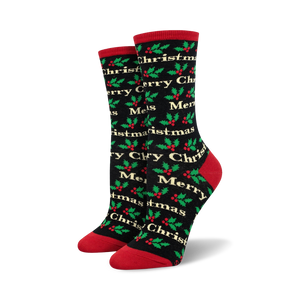 Pair of crew socks in black and red, or cream and green, with a repeating 'Merry Christmas' and holly pattern.