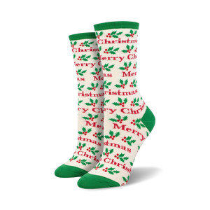 Close-up view of a pair of cream and green 'Merry Christmas' socks.