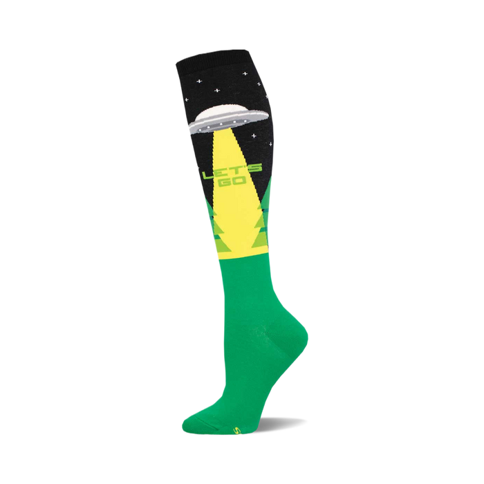 Knee-high green and black sock with a grey UFO, green light beam,